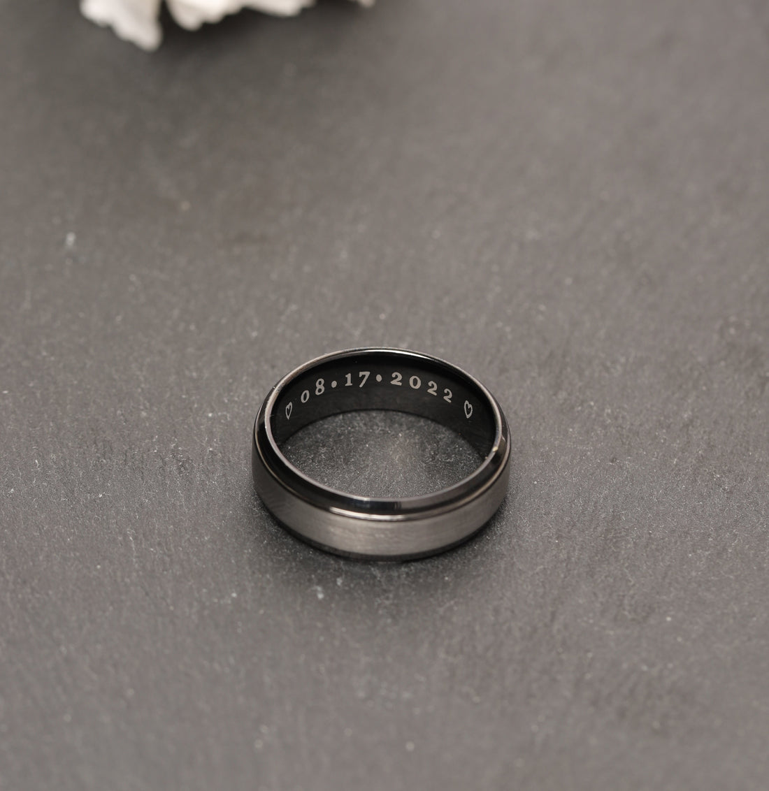 Stylish titanium men's promise ring with a custom engraving, combining a sleek, contemporary look with a durable finish