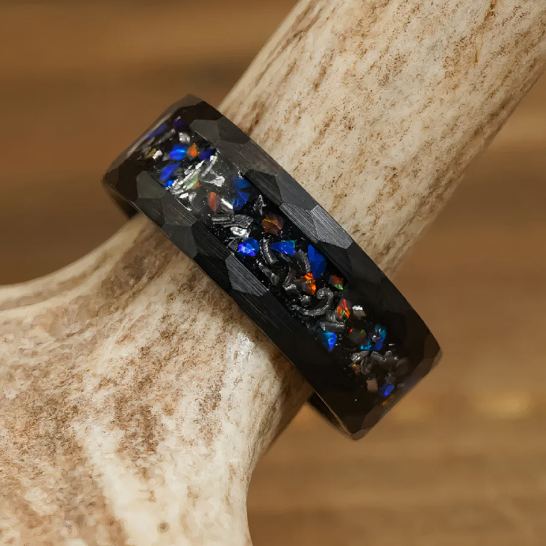 Men's black ring featuring vibrant opal gemstones with a modern design