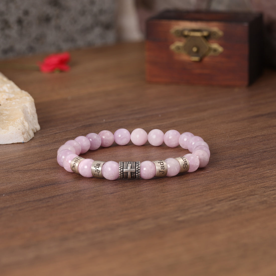 Handmade pink quartz bracelet with cross symbol and engraved family names