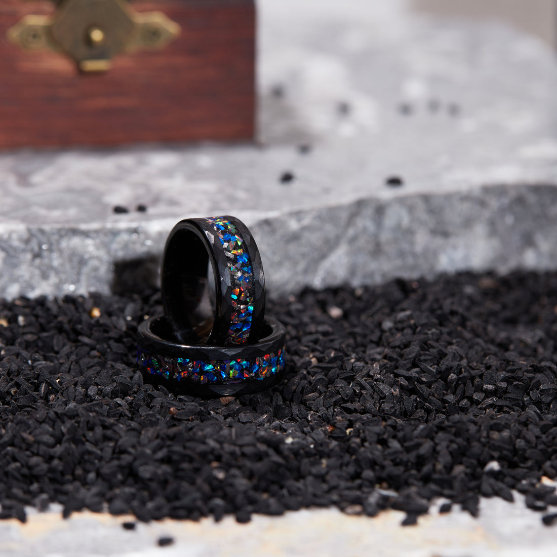 Stunning Nebula-inspired ring with meteorite and opal inlays, set in a sleek 8mm black band