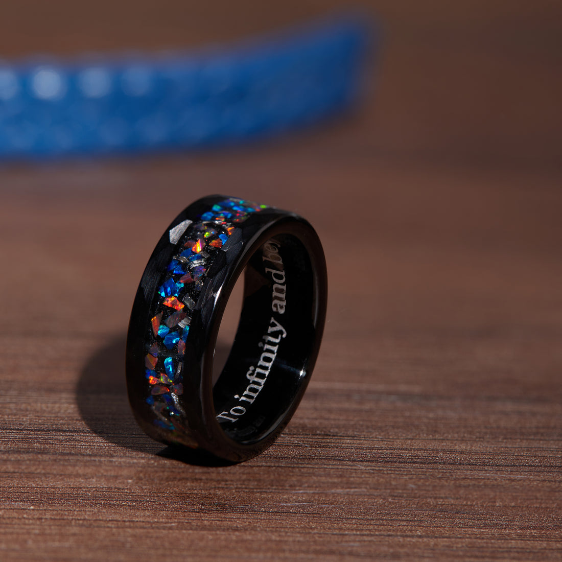 Intricate craftsmanship shown in the 8mm black ring with meteorite and opal, echoing the wonders of space.