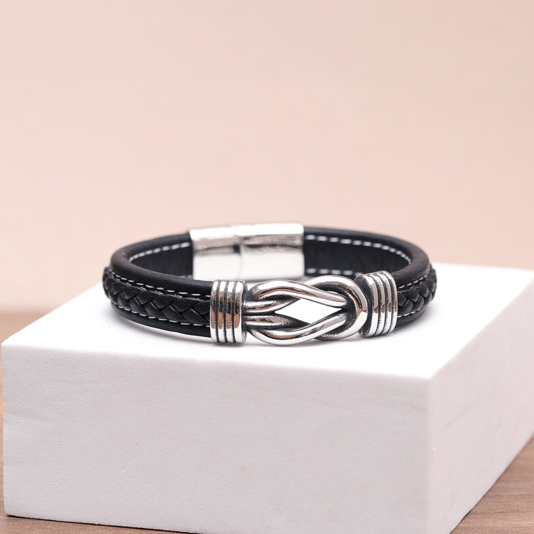 Handcrafted leather bracelet with infinity knot detail, ideal for adding a touch of sophistication.