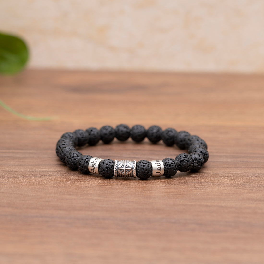 Customizable men's lava stone bracelet with a compass design, signifying the enduring guidance of family bonds, perfect for celebrating love on Valentine's Day